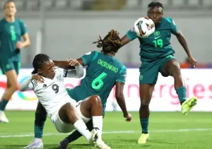 okoronkwo-ijeoma-esther-of-nigeria-challenges-mokgabo-onneille-thanda-of-botswanaduring-the-2024-womens-africa-cup-of-nations-match-between-botswana-and-nigeria-1024x720